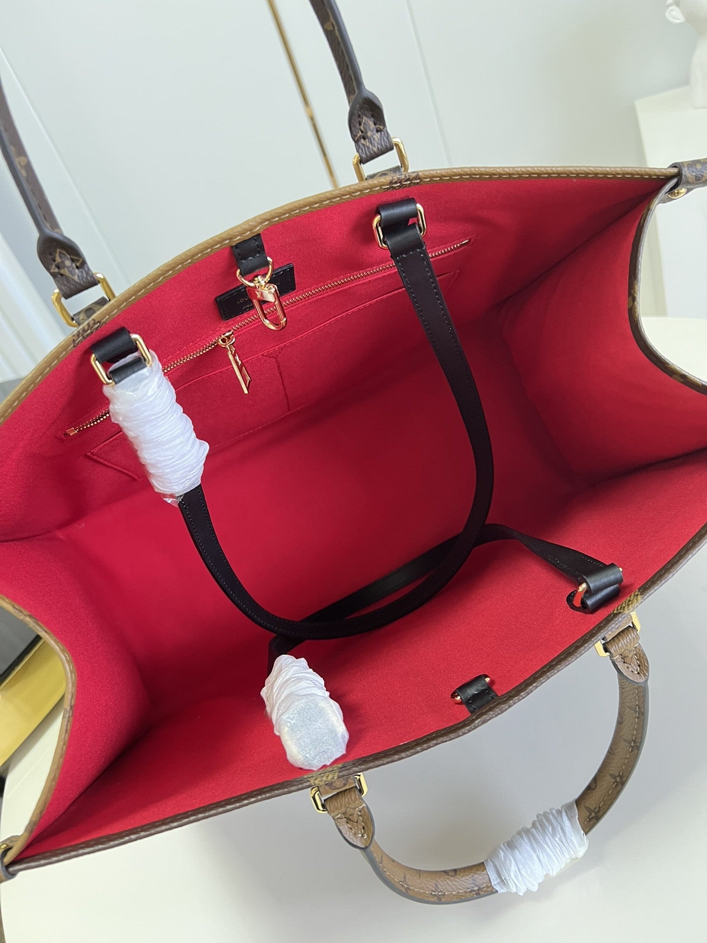 OnTheGo Monogram Canvas Bag