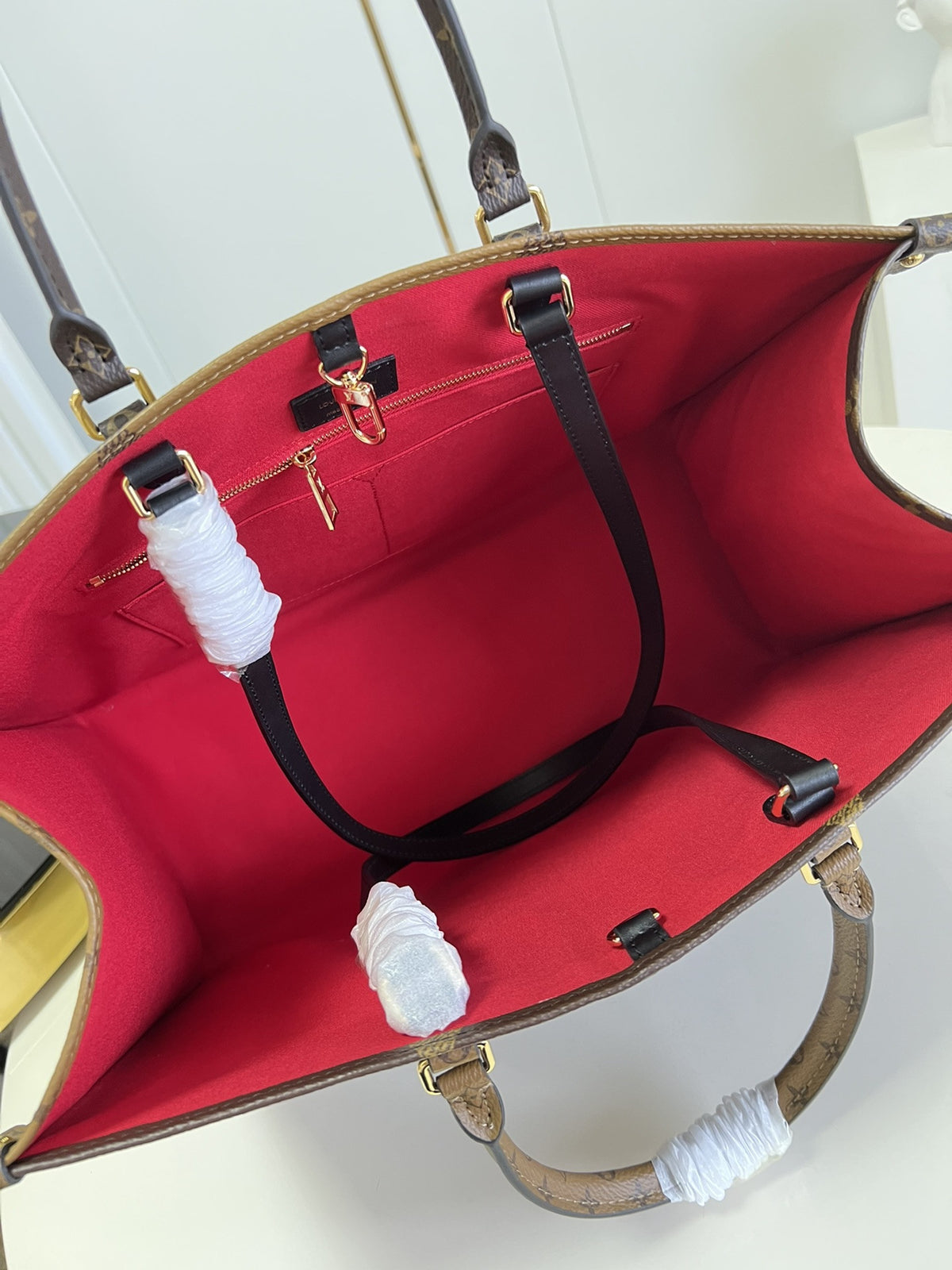 OnTheGo Monogram Canvas Bag